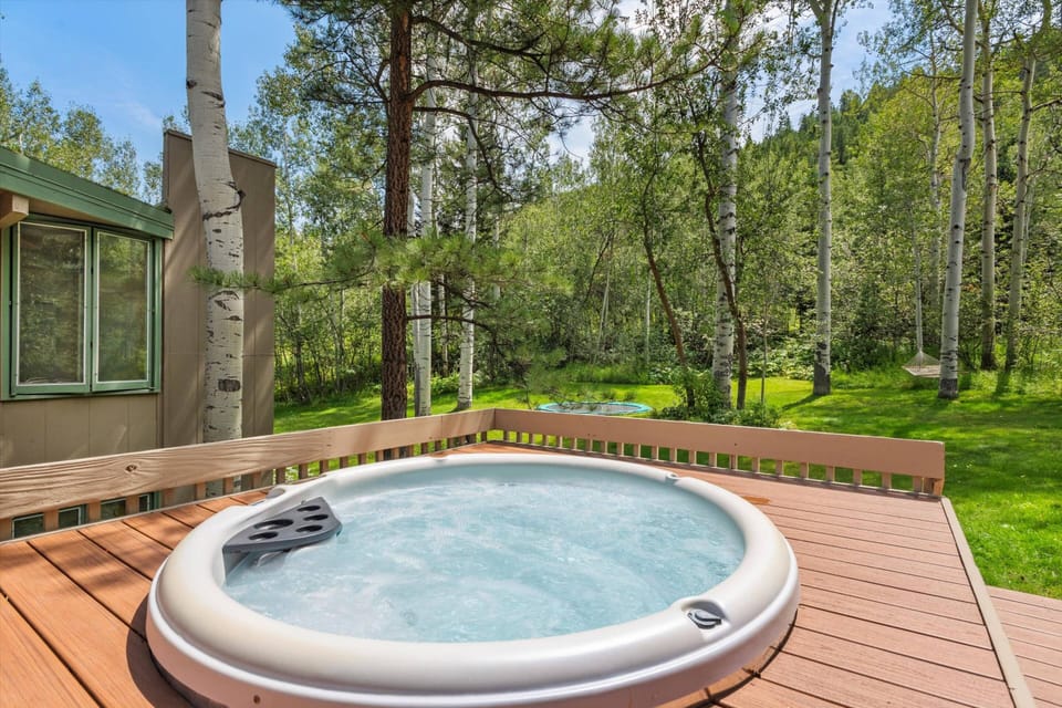 Enjoy the warmth of the hot tub under the summer sun or as snowflakes gently fall around you, creating a serene and picturesque winter escape.