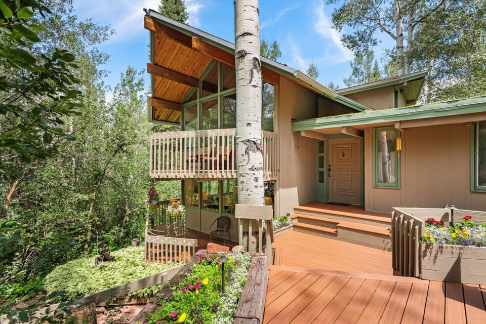 The master suite is located on the top level above the main level living area.