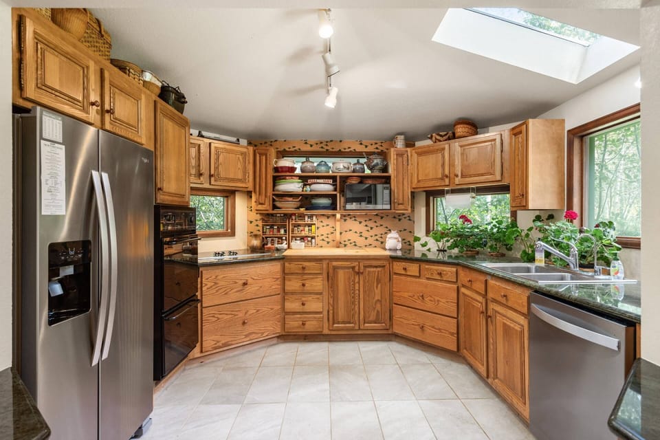 The kitchen is fully stocked and features new appliances and tons of counter and cabinet space.