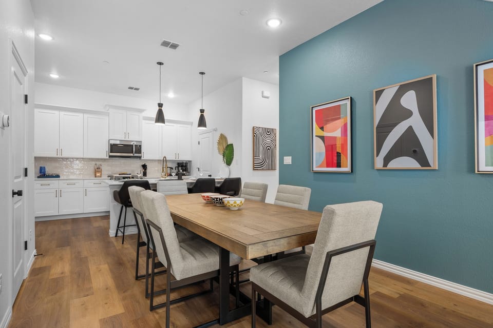 Gather around and eat like you live here. The dining area seats your whole group and flows seamlessly into the full kitchen — ideal for group travel, family stays, and anyone who wants more than a hotel room near Globe Life Field.