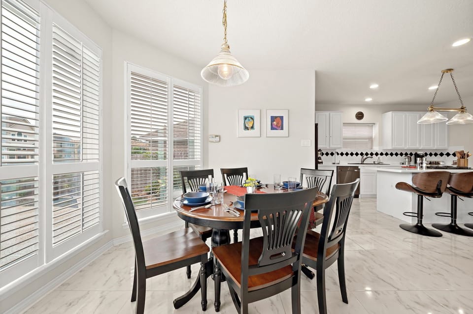 Spacious dining table that sits 6 with full tableware and silverware included.