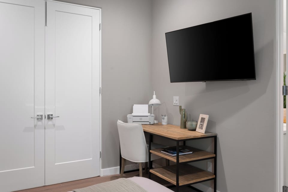 Desk and TV in the bedroom give guests a spot to check emails or catch up on their favorite shows.