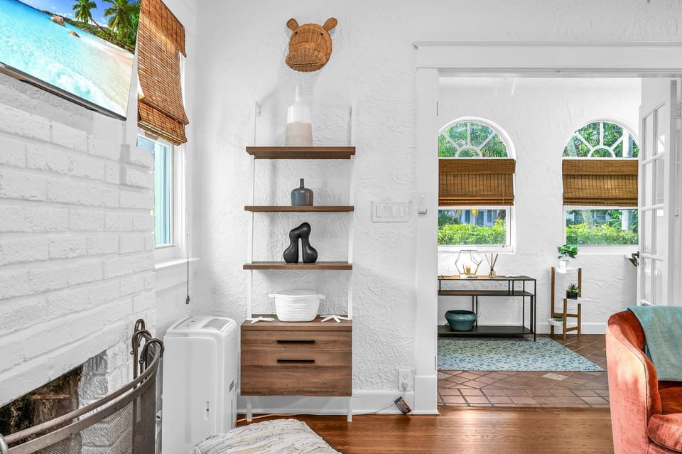 The Living Room is a welcoming space where a decorative fireplace adds warmth to the room. With a selection of books and games, there’s plenty to entertain you, and the open layout allows you