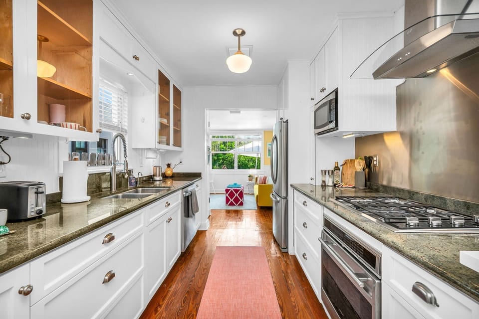 Fully stocked with everything you need, including a gas-range stove, oven, blender, service for 12, coffee maker, and more for culinary enthusiasts.