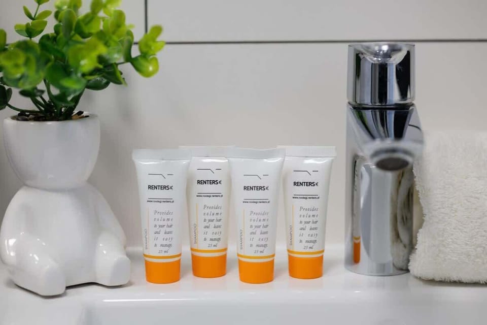 A bathroom shelf with skincare and hygiene products. Neatly organized and well-presented.