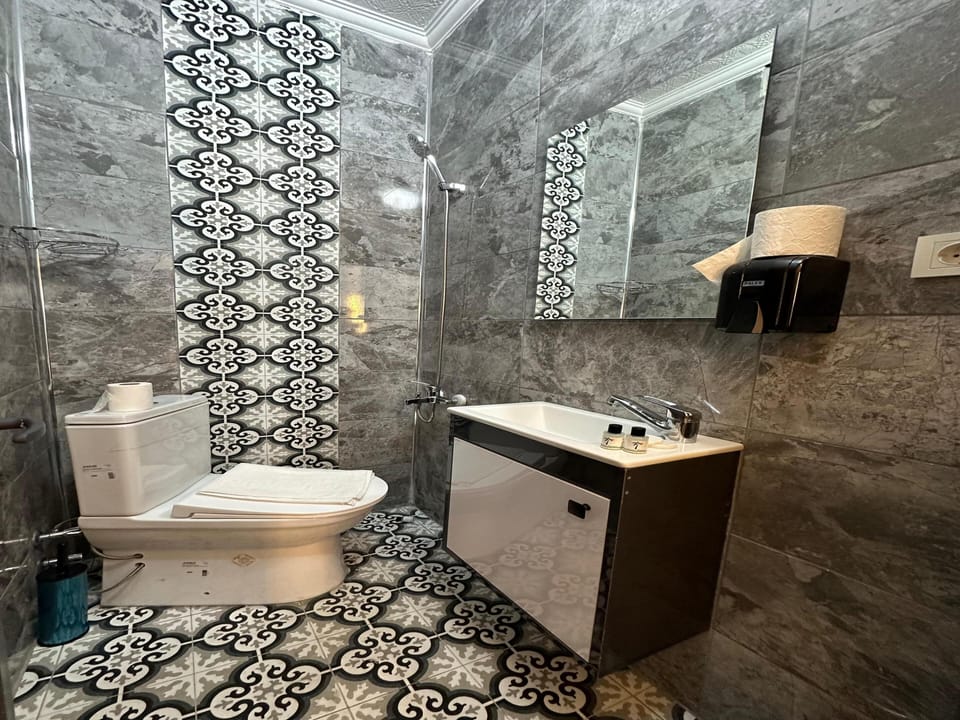Economy Double Room Single Use | Bathroom | Shower, hair dryer, slippers, towels