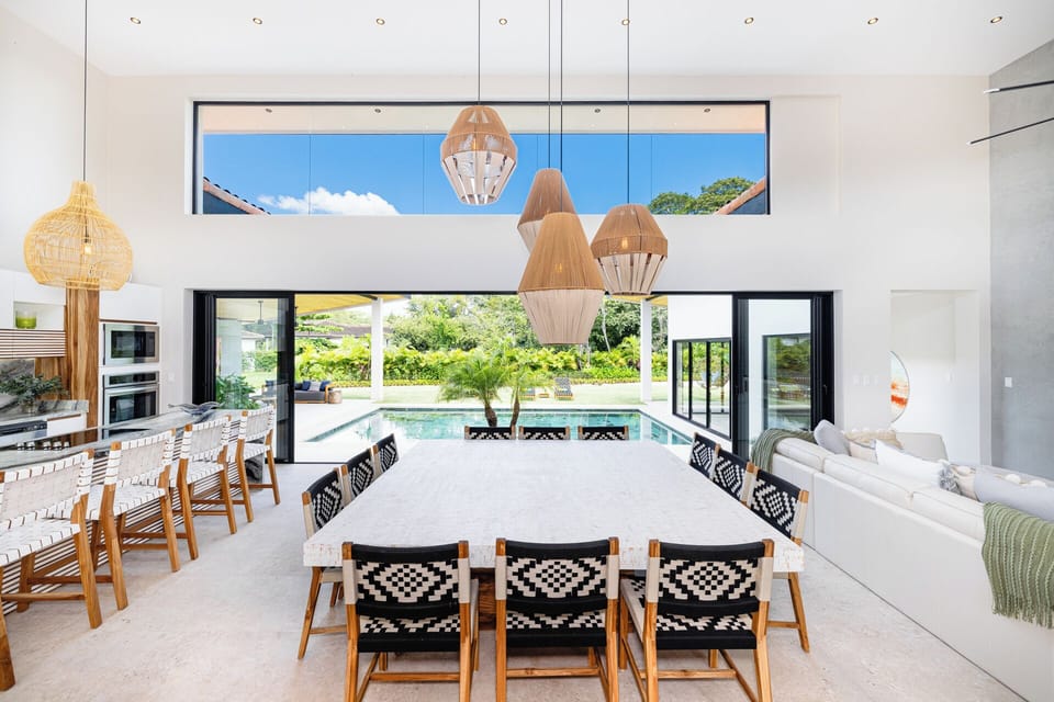 Central kitchen, dining, and living space