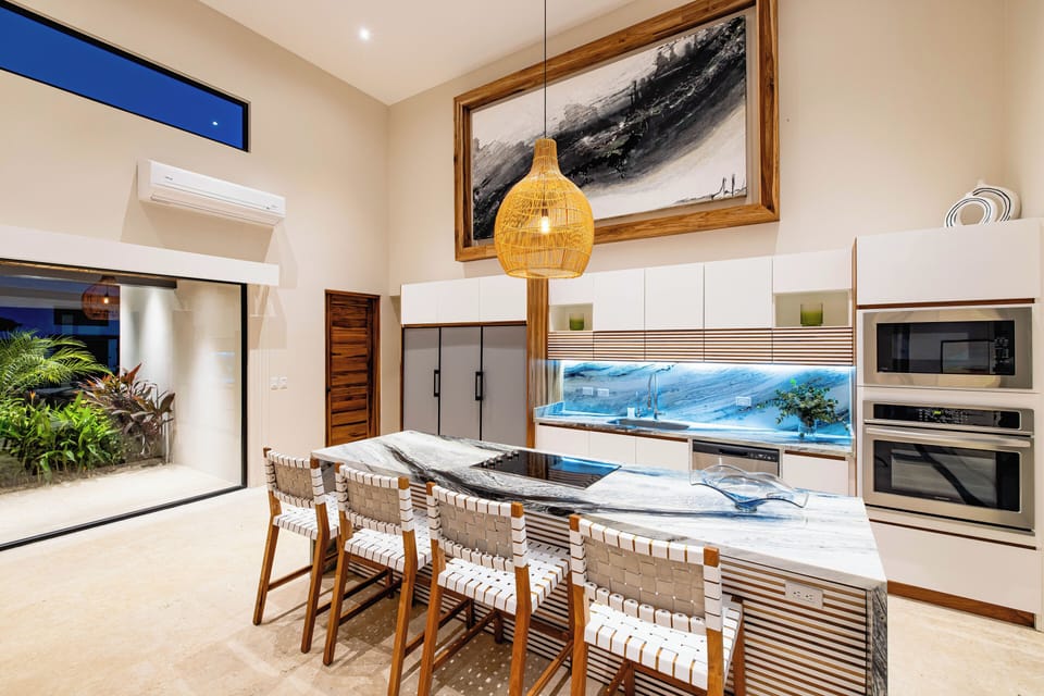 Kitchen - Modern elegance meets pura vida! The perfect space to gather, cook, and sip a chilled drink after the beach.