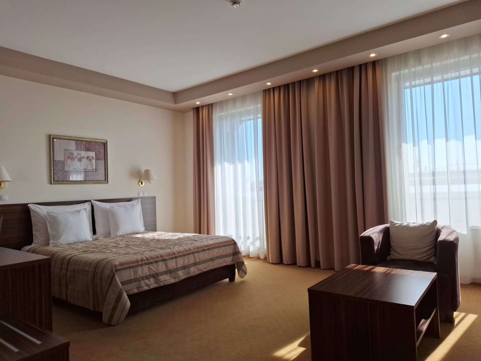 Superior Room, City View | Desk, laptop workspace, blackout drapes, iron/ironing board