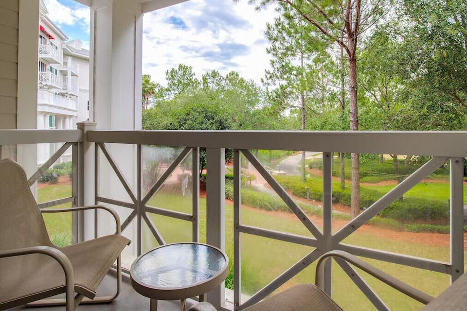 Peaceful balcony with comfy seating, leafy views, and fresh coastal air—perfect for morning coffee or sunset relaxation.