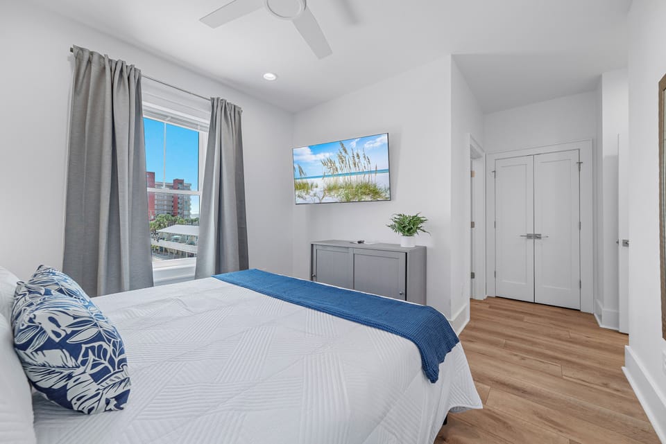 Unwind in our spacious king bedroom with a flat-screen TV and ensuite bathroom