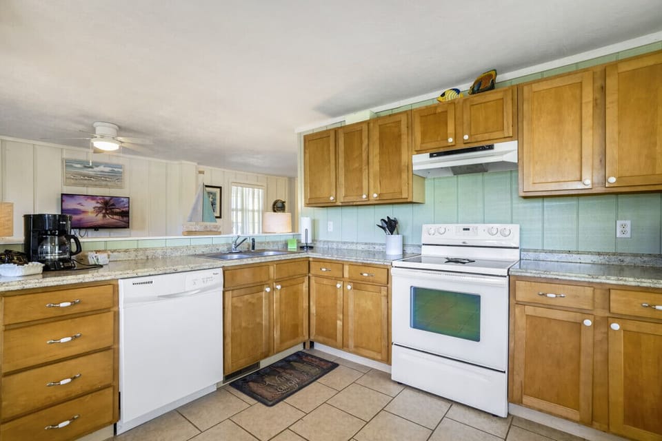 A large and open kitchen is fully stocked with everything you need