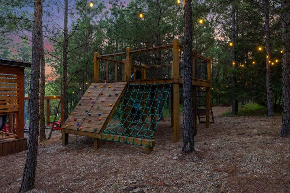 Outdoor play-set with slide, rock climbing wall and climbing net!