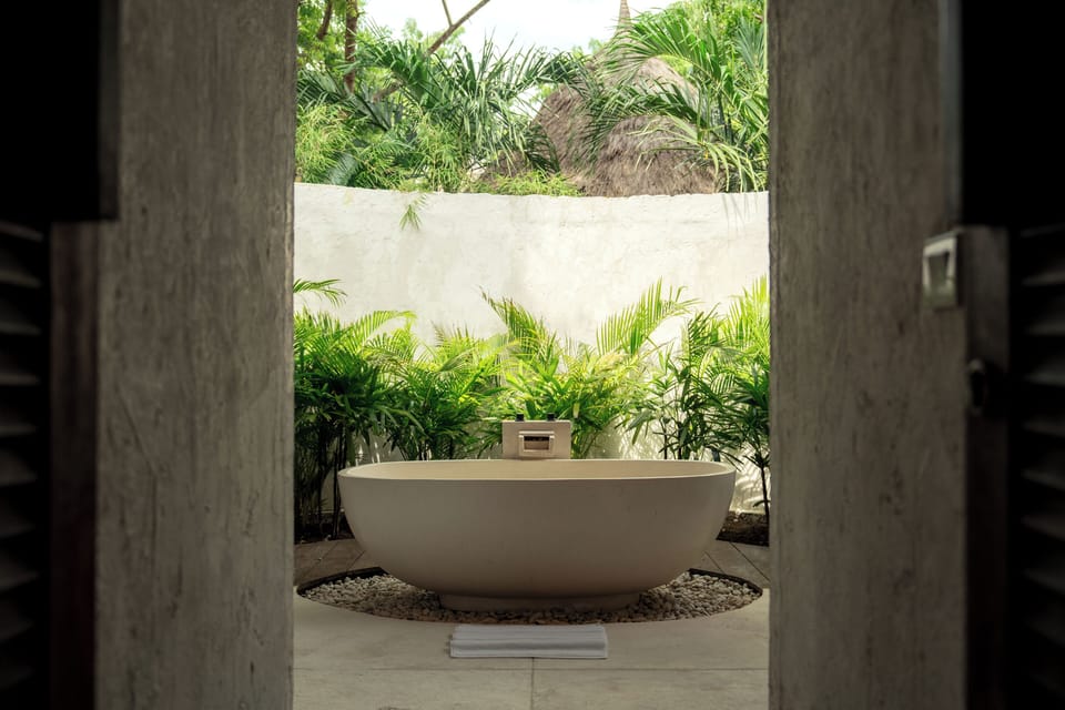 Two Bedroom Beachfront Pool Villa | Bathroom | Eco-friendly toiletries, hair dryer, slippers, towels
