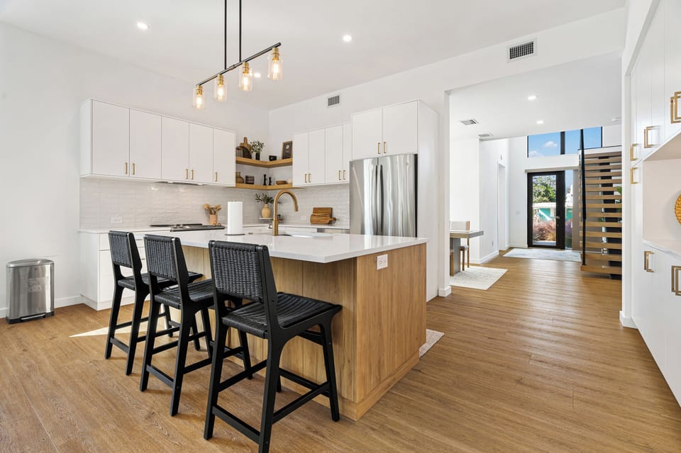 Large kitchen island provides additional counter space, great for larger meal prep.