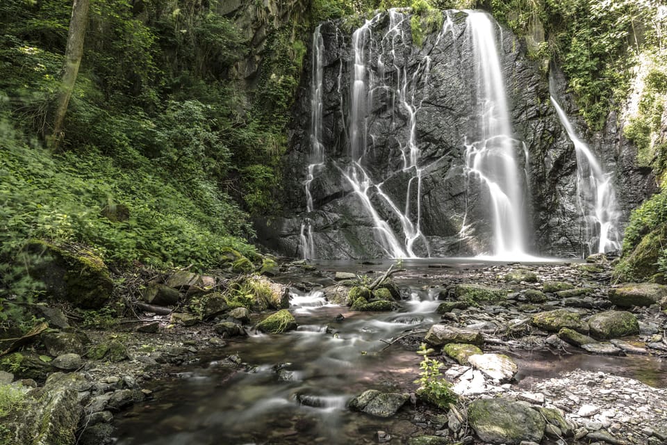 Waterfall in the woods on the border between Switzerland and Italy
