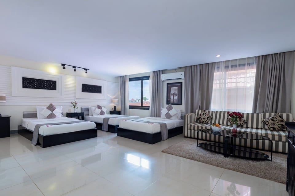 Deluxe Triple Room, Balcony | In-room safe, desk, laptop workspace, free WiFi