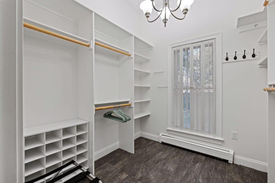 Spacious walk-in closet with ample storage, shelving, and hanging space, perfect for keeping your belongings organized during your stay.