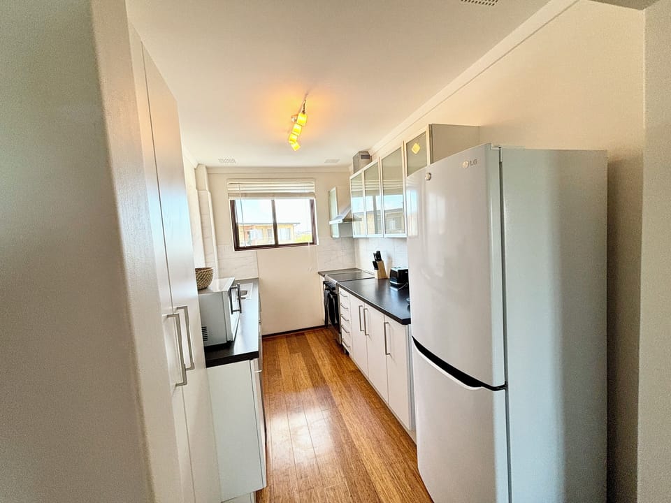 Full fridge, microwave, stove top and oven, dishwasher, coffee maker and much more