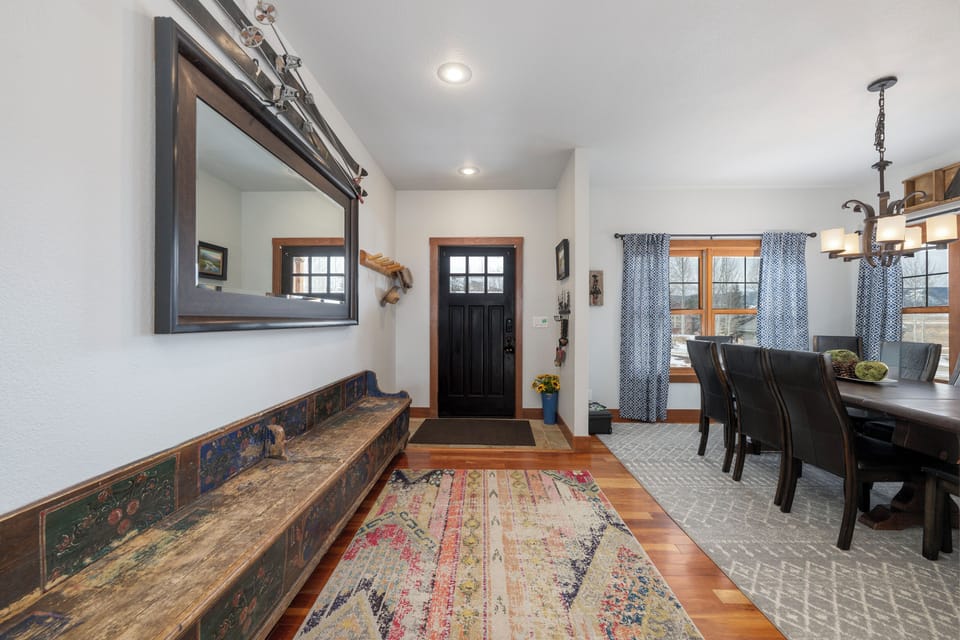 Step into your welcoming entryway where rustic charm meets modern comfort, featuring warm wood floors and thoughtful touches throughout.