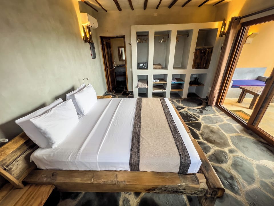 Deluxe Double Room, Beach View | Minibar, in-room safe, free WiFi