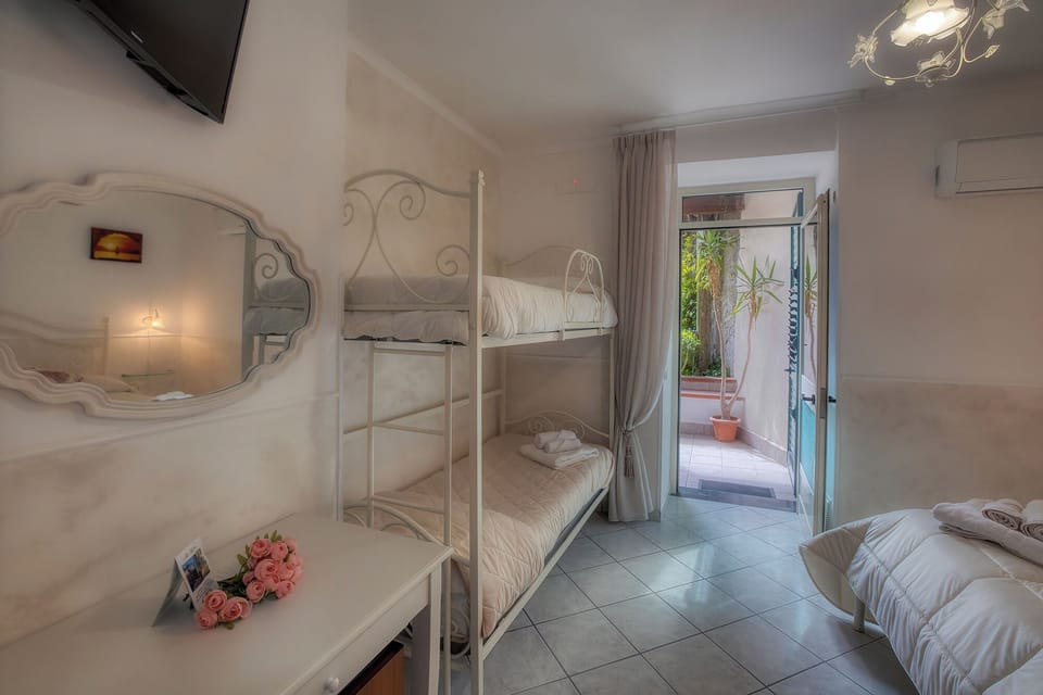 Family Quadruple Room, Garden View | Desk, free WiFi