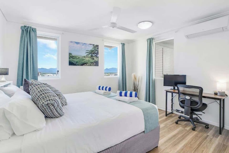 The sunny bedroom has everything you need to relax including a comfortable king-sized bed, workspace, air-conditioning and ceiling fan.

