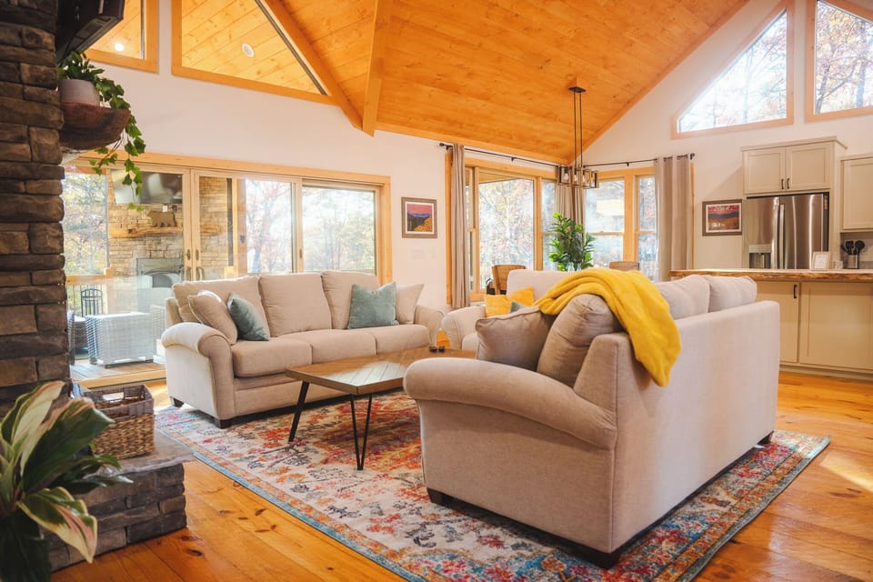 Unwind in open living w/ fireplace, vaulted ceilings, kitchen & island seating.