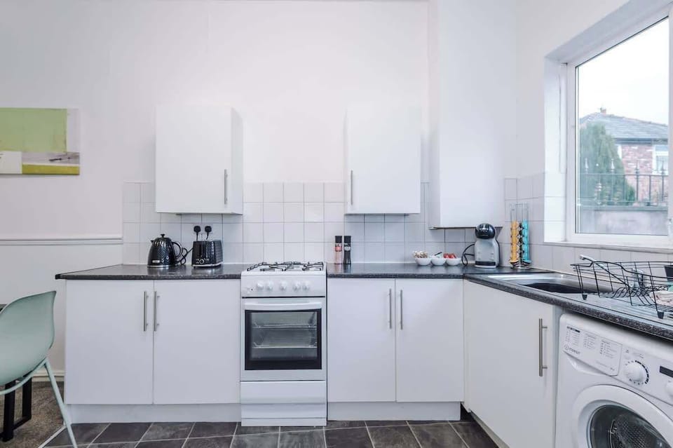 The fully equipped kitchen has everything you need for a long or short stay in Manchester.