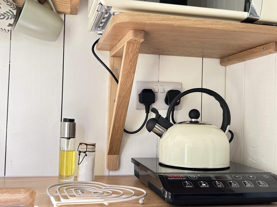 Cabin | Private kitchen | Microwave, stovetop, electric kettle, toaster