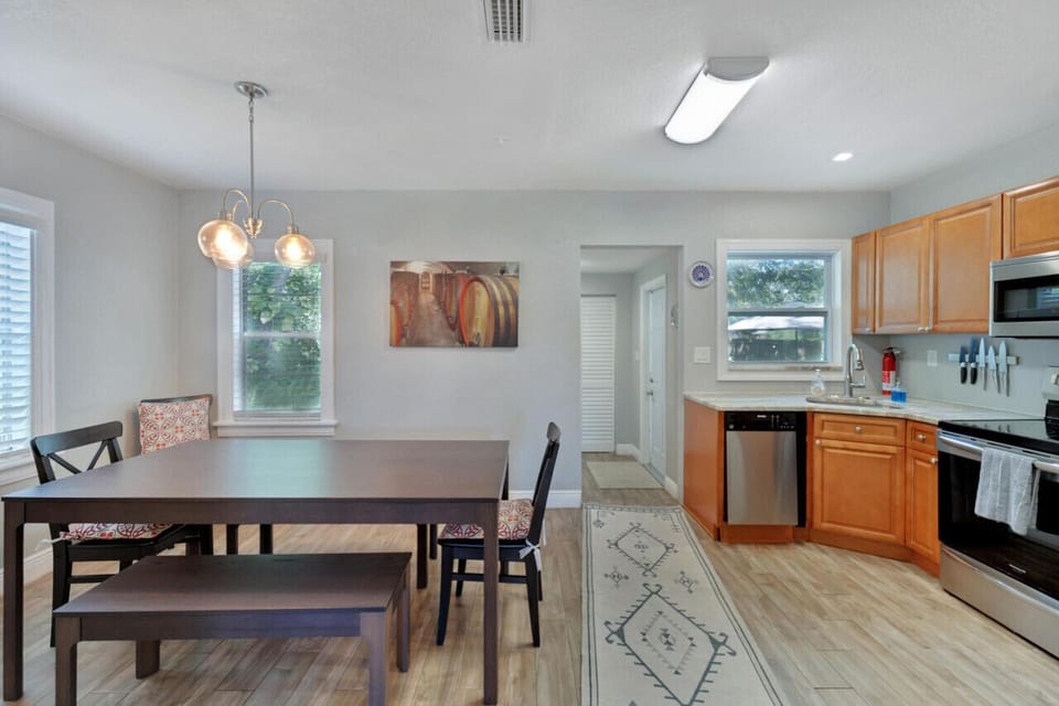 Dining Area & Kitchen with view to Back Door