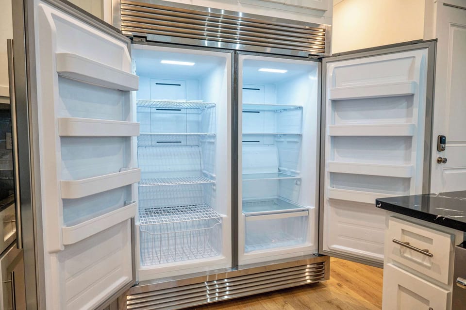 The left side is a freezer and the right is a fridge ready for a large grocery order.