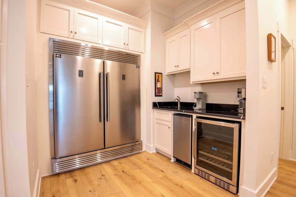 Kitchen boasts dual islands, fully equipped