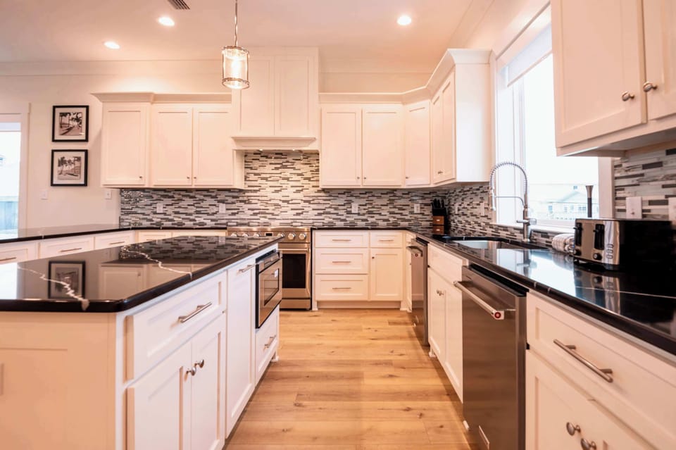 Kitchen boasts dual islands, fully equipped