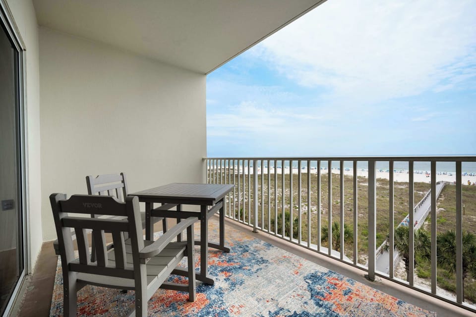 Sip drinks, catch up on some reading, or just enjoy the view from your private beachfront balcony. 