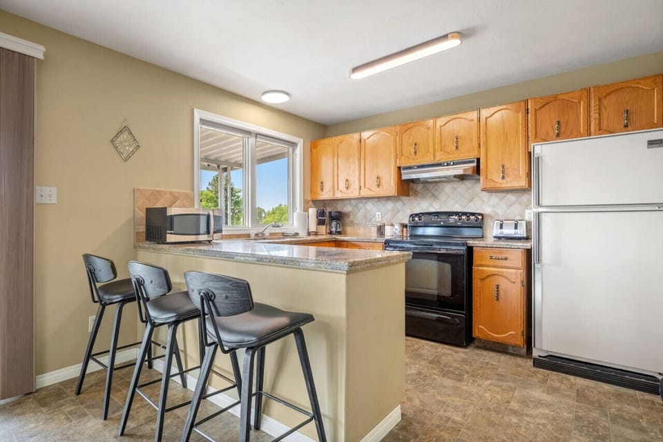 Full kitchen on the main floor, complete with a drip coffee maker & blender.