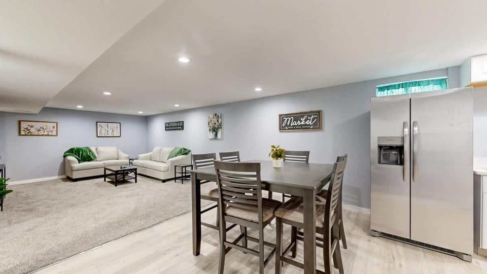 This open-concept home features a seamless flow between the living, dining, and kitchen areas, creating a bright and spacious atmosphere perfect for relaxation and socializing.
