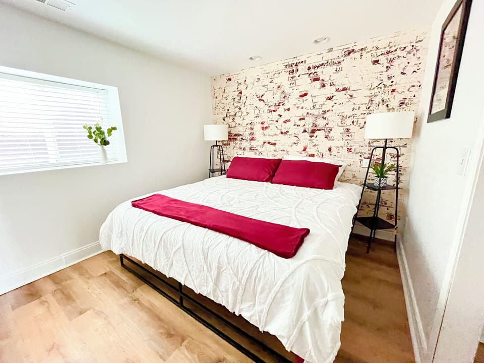 Bedroom with King bed, TV and desk - designated working space.