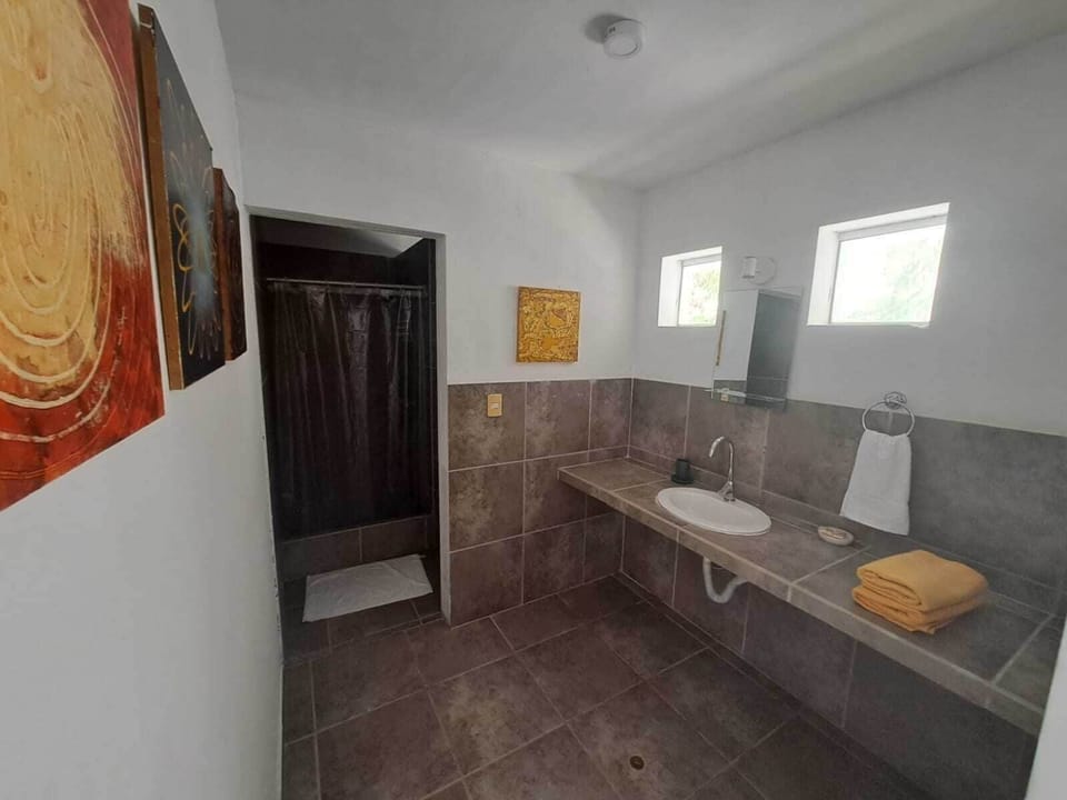 Deluxe Room, Balcony, Beach View | Bathroom | Shower, towels, soap, toilet paper