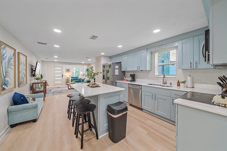 House 1 - The large kitchen island provides additional counter space and is great for larger meal prep.