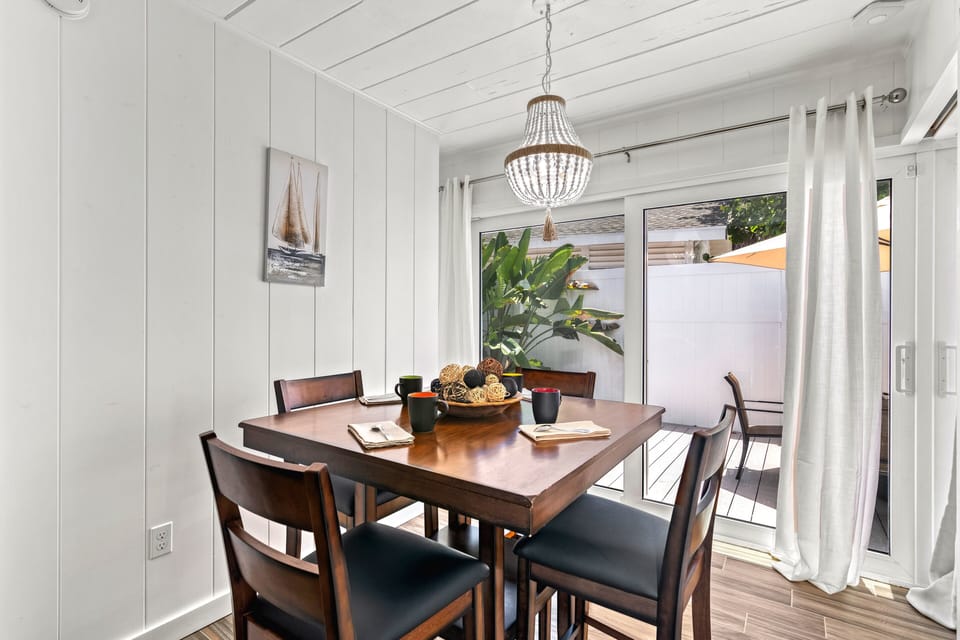 Enjoy your morning coffee here, where sunlight floods in and the deck's fresh air is just a slide away.