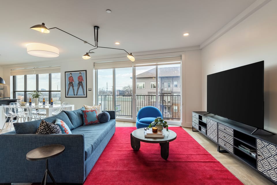 Living room off the balcony featuring a sleeper sofa.