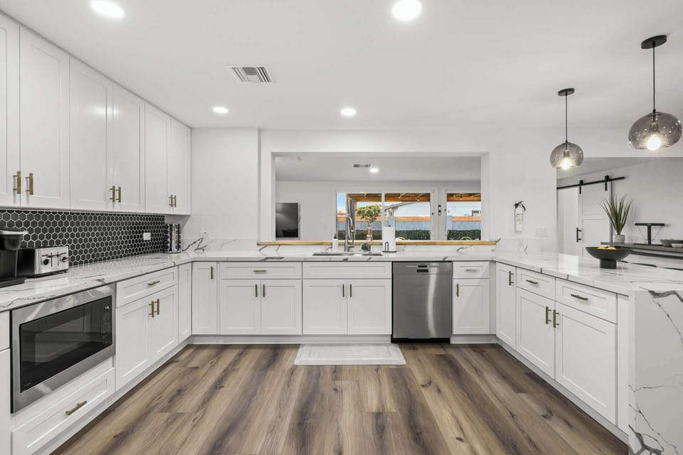 The open design offers  a view of the outdoors from the kitchen.