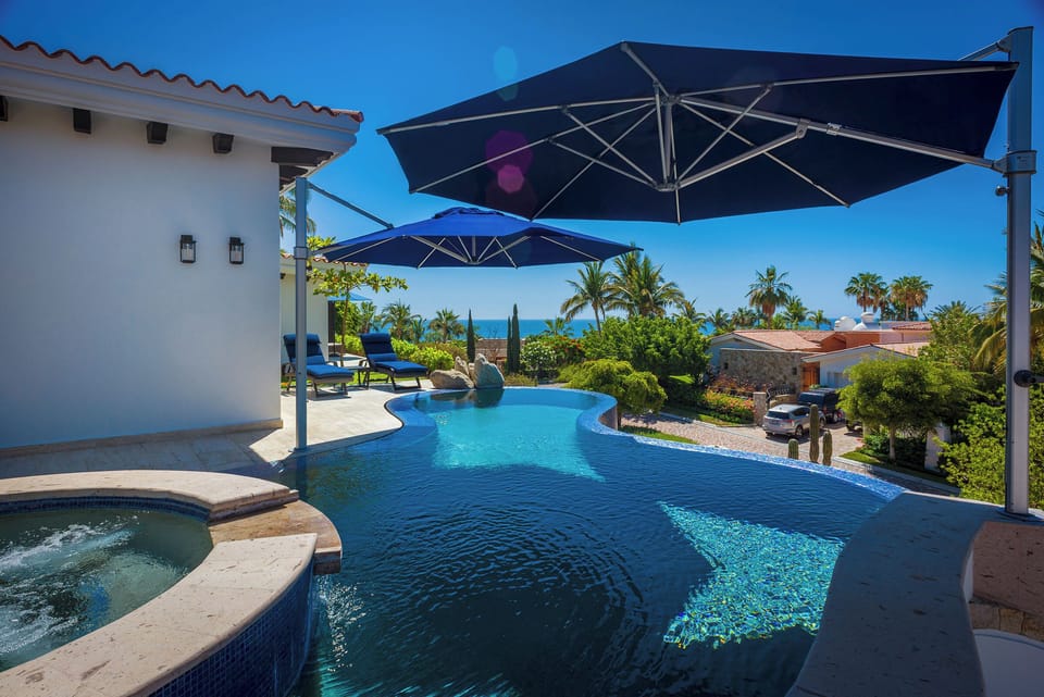 Private heated infinity pool and hot tub with ocean views at Villa Esperanza in Palmilla Caleta, Los Cabos.