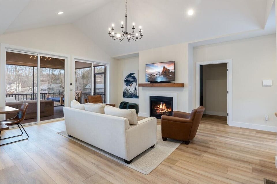 Open-concept living and kitchen area with modern furnishings.