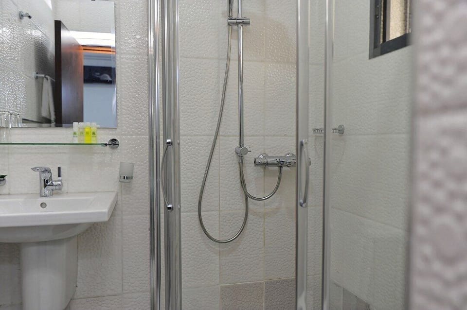 Bathtub, towels, soap, shampoo