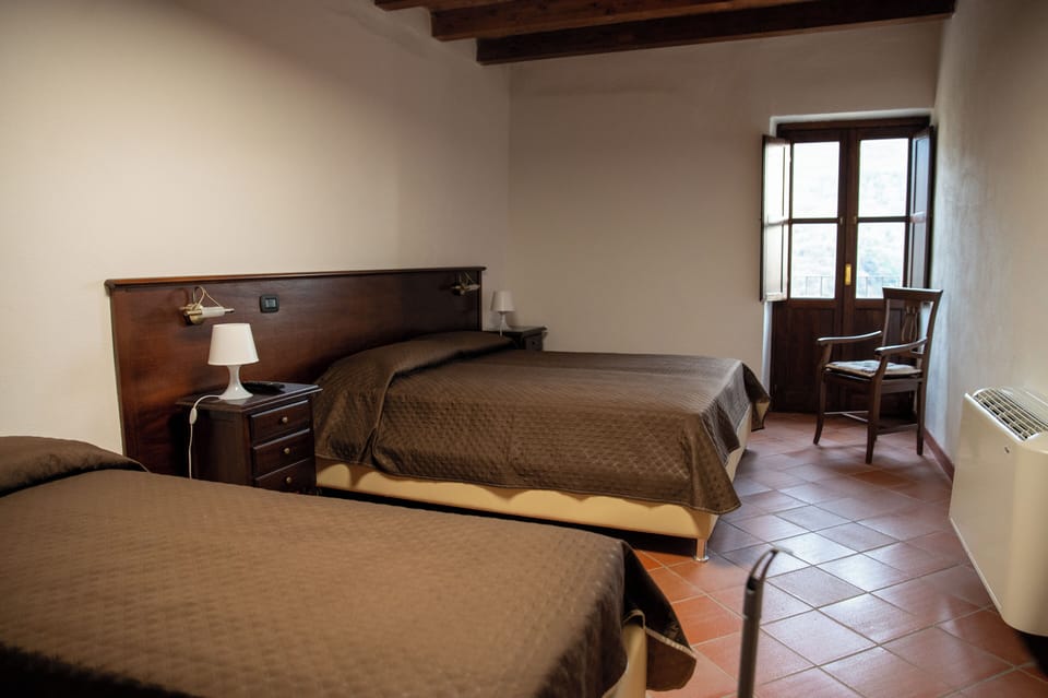 Basic Triple Room, Private Bathroom, Mountain View | In-room safe, desk, laptop workspace, soundproofing