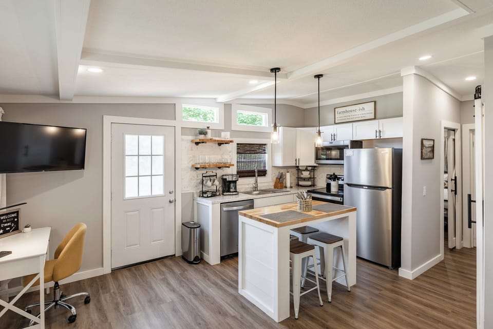 Spacious kitchen with brand new appliances, and a breakfast bar. 