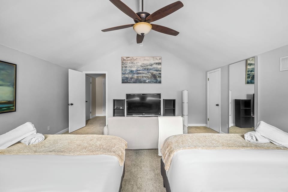 Bedroom 4 has a large wall mirror you can use for a quick outfit check.