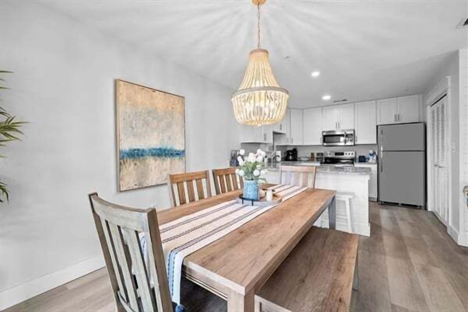 Gather around this elegant wooden dining table for memorable meals.
